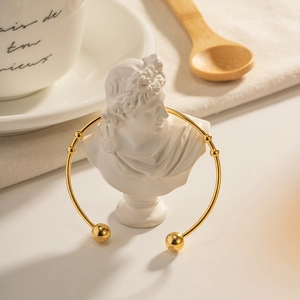French retro 18K gold stainless steel open bangle with ball endpoints in high polish finish