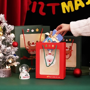 Festive Christmas gift bags in red and green with transparent window and cartoon designs