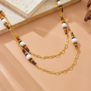 Double-layered gold paperclip chain necklace with white pearls and tiger eye stone beads