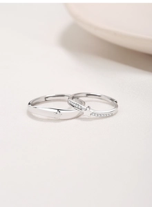 Detailed macro shot of S925 sterling silver couple rings with star pattern and hallmarks