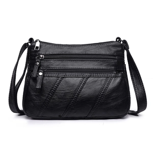 Classic black soft leather crossbody bag with multiple zippers and silver hardware