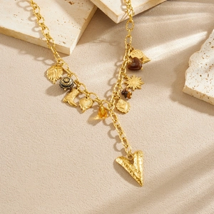 Gold plated stainless steel necklace with heart, leaf, and sun multi-element charms