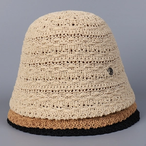 Detail of hand-woven crochet bucket hats with breathable hollow design and metal accents