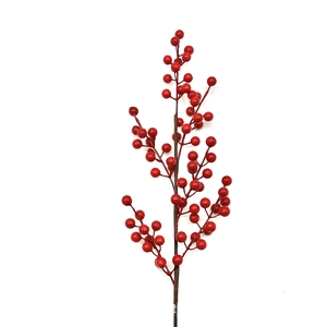 Detailed view of artificial red berries on brown stems for festive home decoration