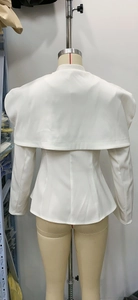 Detailed back view of a white slim-fit blazer featuring a layered shawl collar design