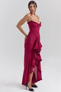 Detailed view of burgundy evening dress with ruffled layers and asymmetric hemline