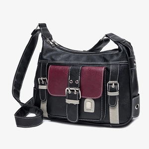 Retro multi-pocket saddle bag in black pebbled leather with burgundy flap and silver hardware