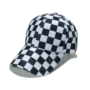 Unisex checkerboard baseball cap with black and white grid pattern and curved brim