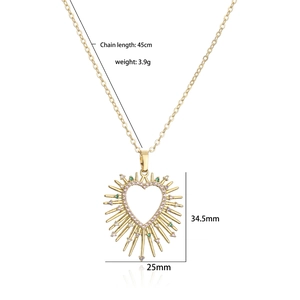 Gold heart necklace with colorful micro-pave zircons and spiky edges on white background