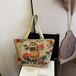 Linen tote bag featuring a colorful sloth illustration and Cartagena text on a chair