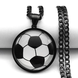 Macro close-up of soccer ball glass pendant necklace with a black metal chain