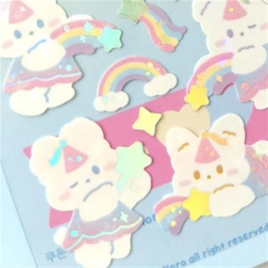 Close-up of cute rainbow bear and star stickers for DIY K-pop photo decoration