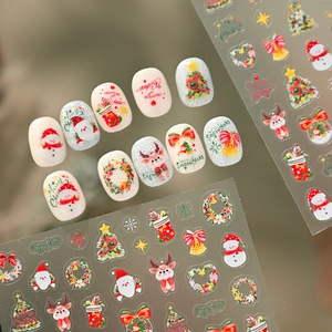 Cute Christmas nail stickers with Santa, reindeer and snowman designs for festive DIY manicures