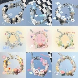 Macro detail of various colorful beaded bracelets with cute cartoon character pendants