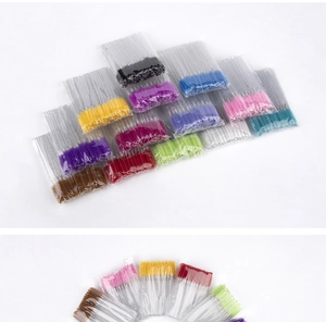 Colorful disposable mascara wands with clear crystal handles in organized bulk packaging