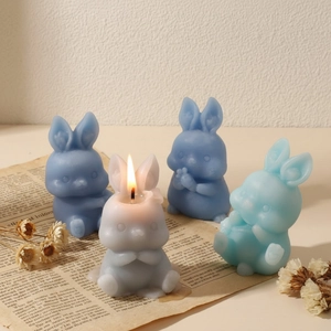 Set of cute 3D rabbit candles in blue and grey for Easter home decor and DIY gifts