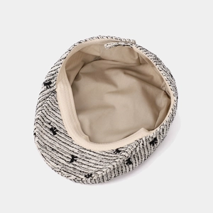Fashionable black and white tweed newsboy hat with bow embroidery and smooth lining