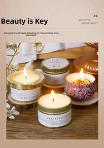 Detail of tin fragrance candles in white and ethnic patterns on rustic wood background