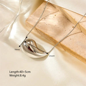 Minimalist silver teardrop pendant necklace on fine snake chain with mirror polish finish