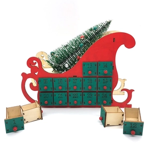 Christmas countdown advent calendar in red wooden sleigh design with 24 small drawers