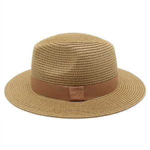 Neutral woven straw Panama hat with a dark brown ribbon band for summer sun protection