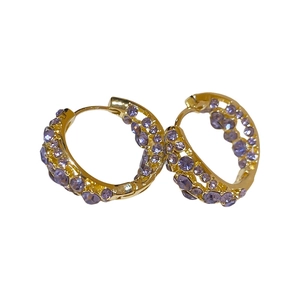 Elegant gold-plated geometric hoop earrings with sparkling lavender crystals on white background