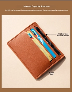 Detailed internal capacity view of brown lychee pattern leather card holder with card slots