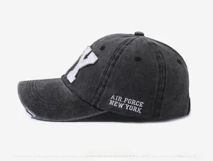 Side view of washed canvas baseball cap featuring vintage distressing and Y embroidery