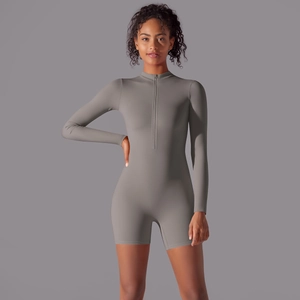 Detail of grey long sleeve athletic romper with stand collar and zipper closure