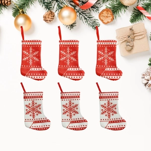 Mini Christmas stocking cutlery holders in red and white knit fabric with snowflakes