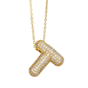 Macro shot of gold balloon letter T pendant necklace paved with sparkling zircons