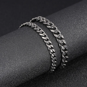 Retro vintage dark gray stainless steel Cuban link bracelet for men on display stand