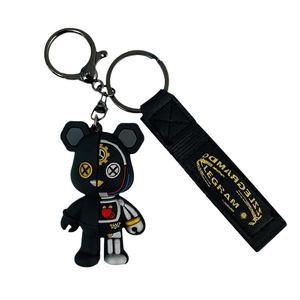 Mechanical punk bear keychain with half-skeleton design and black embroidered lanyard