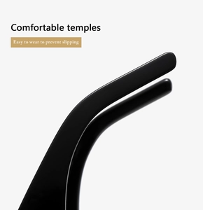 Detailed close-up of ergonomic black resin temple tips on stylish oval sunglasses