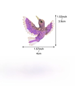 Detail view of a purple hummingbird brooch showing 3.9cm x 4cm size and 10.3g weight