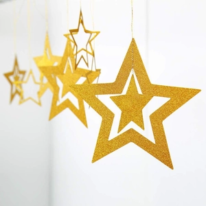 Set of 7 gold glitter hollow star ornaments for festive Christmas and New Year ceiling decor