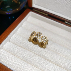 Detail of 14k gold plated ring with zircons in a walnut jewelry box with soft lining