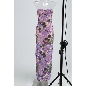 Detail of purple sequin floral embroidery and mesh fabric on a strapless evening gown
