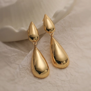 Minimalist gold-plated drop earrings in a double teardrop design on a clean white background