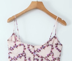 Detailed view of pink floral bodycon dress with spaghetti straps and rear zipper