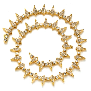 Gold hiphop cuban link necklace with rhinestone spikes in a punk rock design