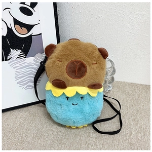 Detail of Capybara plush bag with blue body and brown head on decorative background