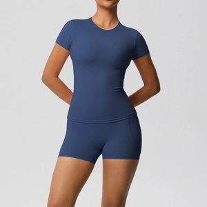 Detail of slim fit navy blue yoga set featuring short sleeve t-shirt and high waist shorts