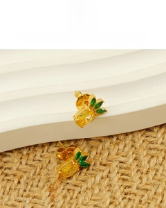 Detail of 18k gold plated pineapple stud earrings with sparkling yellow and green crystals