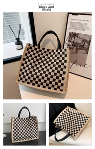 Detail of checkered linen tote bag with reinforced handles and vintage aesthetic