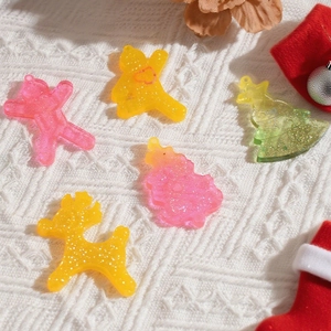 Translucent resin Christmas ornaments with glitter, featuring reindeer and tree shapes