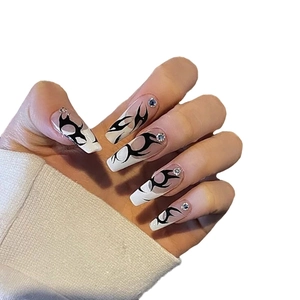 Long trapezoid press-on nails in white with black totem patterns and crystal rhinestones