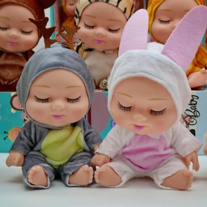 Close-up of 8-inch BJD sleeping dolls wearing grey deer and white rabbit outfits