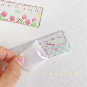 Detail showing removal of protective film from a 15cm cute acrylic ruler with tulip decor