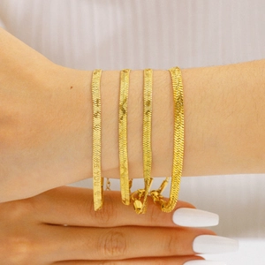 Minimalist 18K gold plated stainless steel flat snake chain bracelet on female wrist